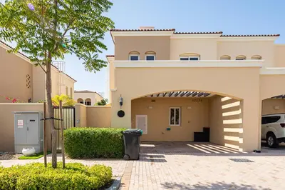 a house with an archway in front of a driveway at Frank Porter - Serena Casa Viva in Dubai