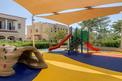a playground with a slide and an elephant on the ground at Frank Porter - Serena Casa Viva in Dubai