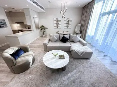 a living room with a couch and chairs and a table at Fantastic flat in TiaraResidence in Dubai