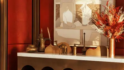 a shelf with vases and other items on it at Jumeirah Residences Marsa Al Arab Dubai in Dubai