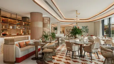 a restaurant with tables and chairs in a room at Jumeirah Residences Marsa Al Arab Dubai in Dubai
