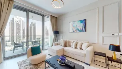 a living room with a white couch and a large window at Luxury 1 Bedroom Sea View and Infinity Pool in Dubai