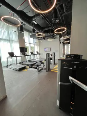 an empty room with desks and chairs in a building at Luxury 1 Bedroom Sea View and Infinity Pool in Dubai