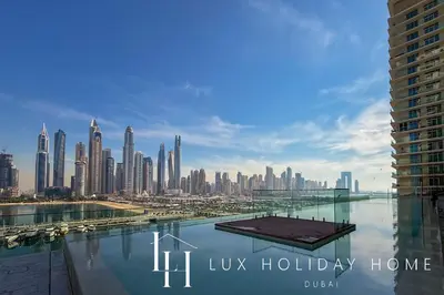a view of a city skyline with a body of water at LUX The Luxury Sunrise Beachfront Suite 1 in Dubai