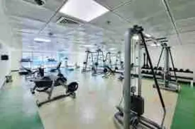 a gym with cardio equipment in a room at Amazing Largest Studio in Marina Next to Metro - Central Location in Dubai