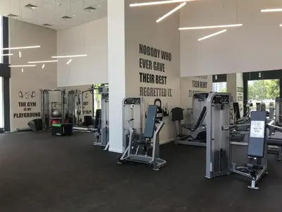 a gym with several tread machines in a room at Fancy One Bedroom Apartment in Downtown Dubai By ĀYA Boutique in Dubai