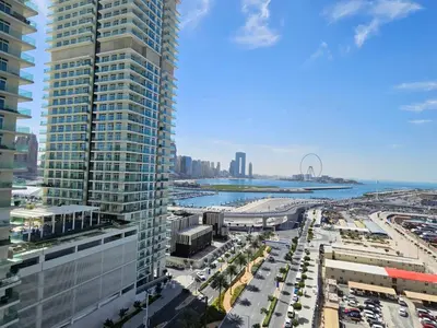 an aerial view of a city with tall buildings at Vacay Lettings - Private Beach Access -Emaar Beachfront in Dubai