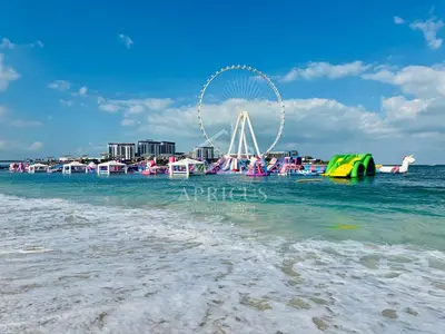 a beach with a ferris wheel in the water at Canal View apartment in Address Beach Residence JBR, the 29th floor, 1BR in Dubai