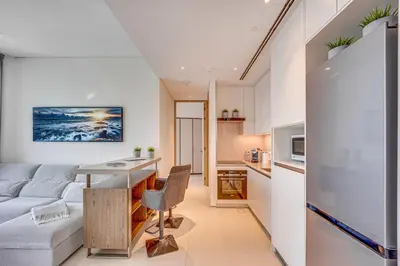 a living room with a couch and a table at Canal View apartment in Address Beach Residence JBR, the 29th floor, 1BR in Dubai