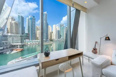 a room with a desk and a large window at Vacationer I Elegant 1 Bedroom Apartment I Marina Views I Walk to Marina Mall I Silverene Tower B in Dubai