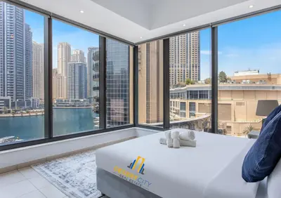 a hotel room with a view of the city at One Bed in Dubai Marina with Marina Views, Hosted by Desert City Stays in Dubai