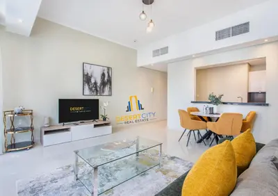 a living room with a couch and a table at One Bed in Dubai Marina with Marina Views, Hosted by Desert City Stays in Dubai
