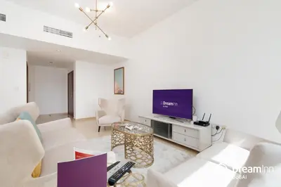 a living room with a couch and a tv at Dream Inn Apartments - Sadaf Residence JBR in Dubai