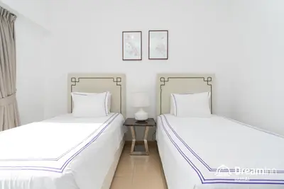two beds sitting next to each other in a room at Dream Inn Apartments - Sadaf Residence JBR in Dubai