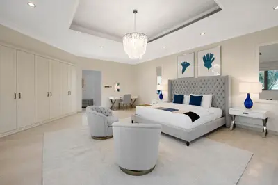 a bedroom with a bed and a couch and a chair at Maison Privee - Exclusive Villa with Private Pool, Garden & Beach in Dubai