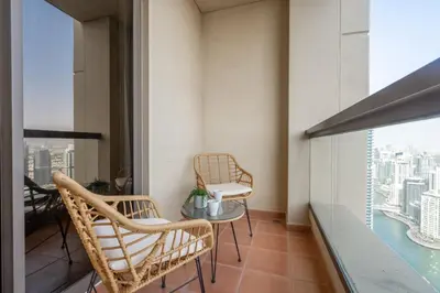 a balcony with two chairs and a table with a view at GuestReady - Modern and luxe near JBR Beach in Dubai