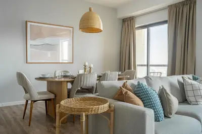 a living room with a couch and a table at GuestReady - Modern and luxe near JBR Beach in Dubai
