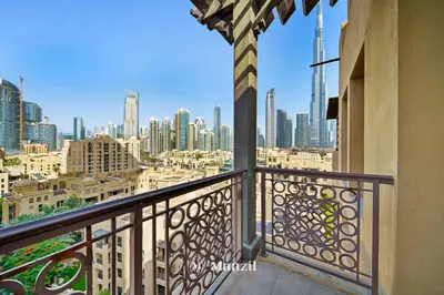 a balcony with a view of the city at Manzil - Cozy 2BR Penthouse with Private Terrace and Full Burj View in Downtown in Dubai