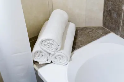 a pile of towels sitting on top of a shower at Impressive View 2BR in Dubai Marina Walk2Beach in Dubai