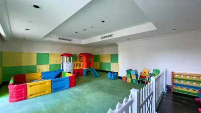 a childrens room with a play area with colorful toys at Luxurious Unique 2 Bed with Private Jacuzzi & Garden - Connected to Souk Al Bahar - Dubai Mall in Dubai