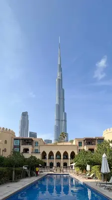 a view of the burj khalifa from the swimming pool at the sh at Luxurious Unique 2 Bed with Private Jacuzzi & Garden - Connected to Souk Al Bahar - Dubai Mall in Dubai
