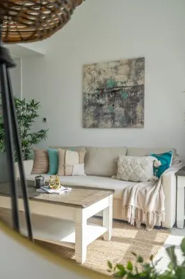 a living room with a couch and a table at GuestReady - Exquisite getaway with Marina views in Dubai