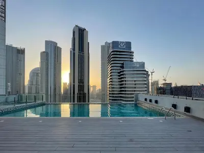a swimming pool in a city with tall buildings at GuestReady - Luxurious Accents near Burj Khalifa in Dubai