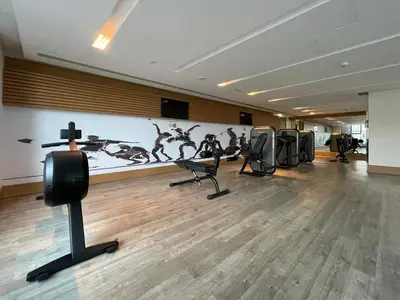 a gym with a row of chairs in a room at GuestReady - Luxurious Accents near Burj Khalifa in Dubai