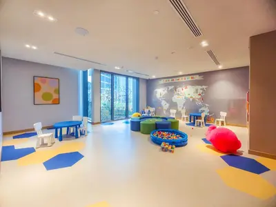 a room with a childs room with a play area at Bright and Splendid 1BR with Marina View in Dubai