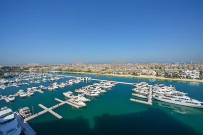 an aerial view of a marina with boats in the water at 2 BD Tiara Palm Views, Beach & Pool, Amazing views of the Palm in Dubai