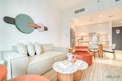 a living room with a couch and a table at Classic 1BR at Harbour Views Tower 1 by Deluxe Holiday Homes in Dubai