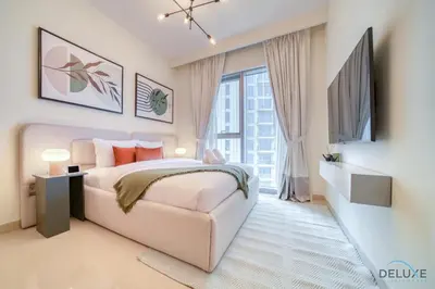 a bedroom with a bed and a large window at Classic 1BR at Harbour Views Tower 1 by Deluxe Holiday Homes in Dubai