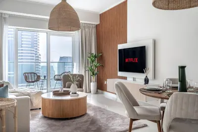 a living room with a couch and a table at GuestReady - Sweet Paradise near Marina Walk in Dubai