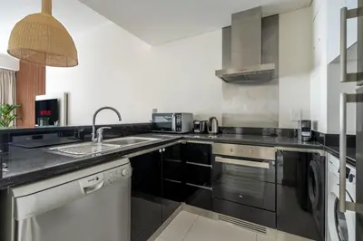 a kitchen with a sink and a counter top at GuestReady - Sweet Paradise near Marina Walk in Dubai