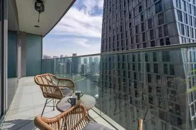 a balcony with two chairs and a table at GuestReady - Sweet Paradise near Marina Walk in Dubai