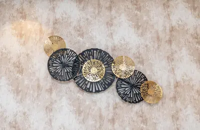 a group of four different colored plates on a wall at LuxBnB Paramount Midtown SeaView in Dubai