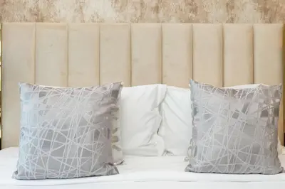 two pillows sitting on top of a bed at LuxBnB Paramount Midtown SeaView in Dubai