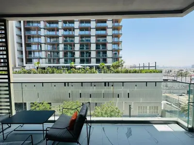 a balcony with a view of a large building at Luxurious 1-bedroom apartment in Dubai Hills in Dubai