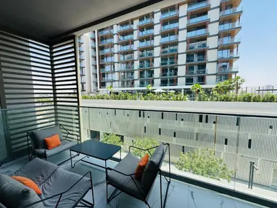 a balcony with a view of a building at Luxurious 1-bedroom apartment in Dubai Hills in Dubai