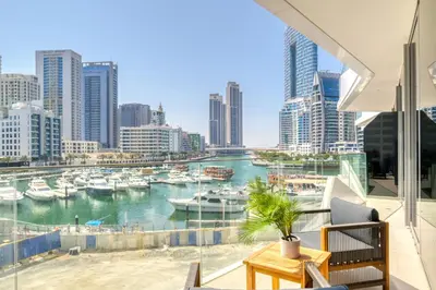 a balcony with a view of a harbor with boats at Spacious 1 Bed Apt - Stella Maris at Dubai Marina By PK Holidays in Dubai