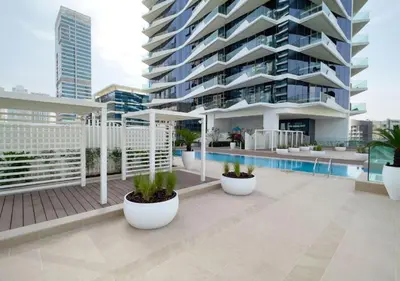 a large apartment building with a swimming pool at Spacious 1 Bed Apt - Stella Maris at Dubai Marina By PK Holidays in Dubai