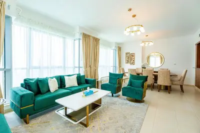 a living room with a couch and a table at INA Homes-Residences Tower 7 Full Burj Khalifa & Fountain Views in Dubai