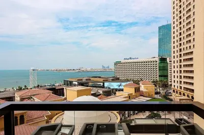 a view of the ocean from a balcony of a building at Elan Rimal Suites JBR Beach Sea View in Dubai