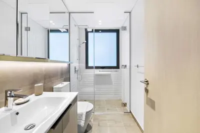 a bathroom with a sink and a toilet and a shower at Silkhaus brand new studio in Belgravia Heights, JVC in Dubai