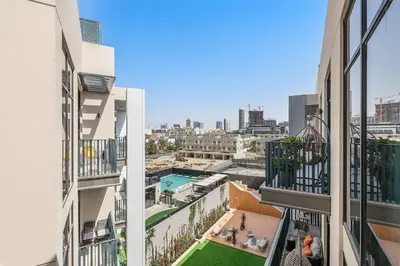 an apartment balcony with a view of the city at Silkhaus modern studio in the heart of vibrant JVC in Dubai