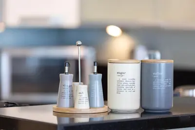 a group of three hair products sitting on a counter at Songs of the Lake by Lagom - Bonnington Apartment Jumeirah Lake Towers, in Dubai