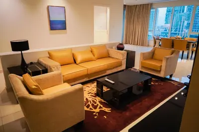 a living room with a couch and two chairs at Al Ashrafia Saray Magnificent 3BR Canal Views in Dubai