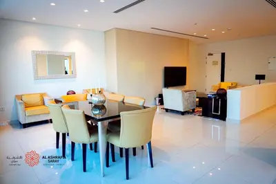 a dining room with a table and chairs at Al Ashrafia Saray Magnificent 3BR Canal Views in Dubai