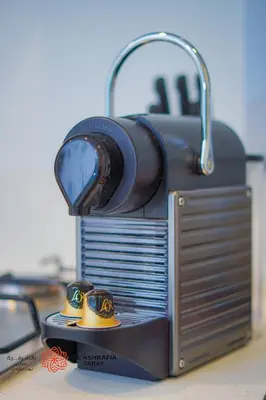 a model of a toaster oven with two rings on it at Al Ashrafia Saray - Extraordinary Studio in Canal View in Dubai