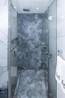 a shower with a glass door in a bathroom at Lux Studio in Downtown, 5 mins to Burj Khalifa & Dubai Mall - MAG318 in Dubai
